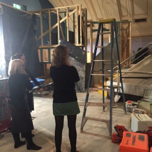 Curators survey the new 'amphitheater' which will show coloured footage of liberation.