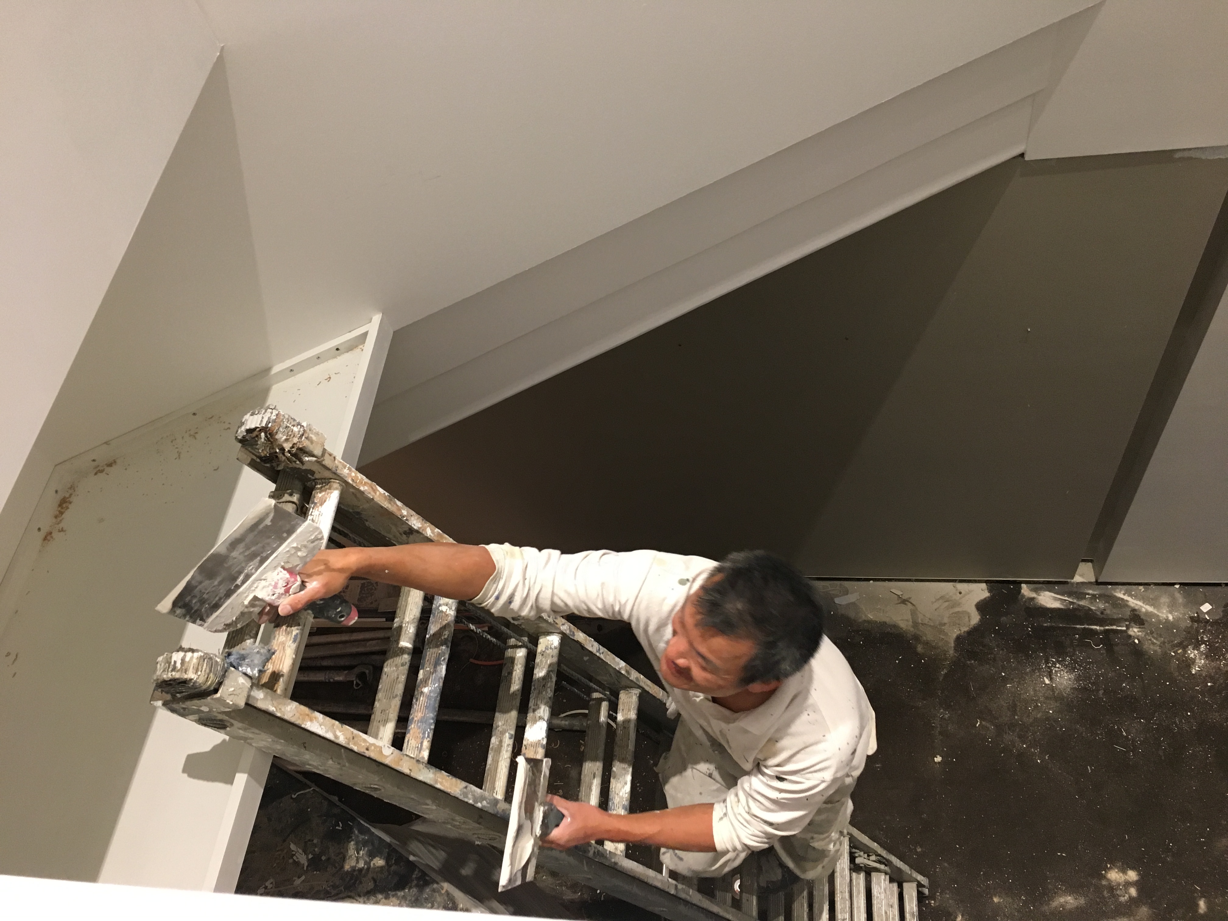 Painters adding a fresh coat of paint. 