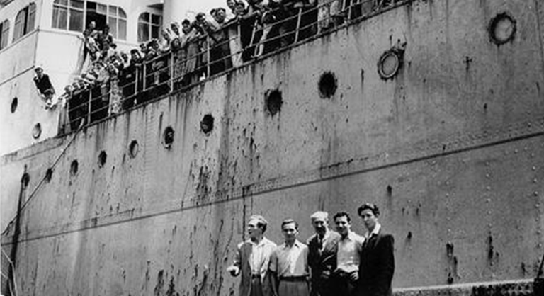 B&W photograph of European Jewish migrants arriving aboard the SS Derna, 6 November 1948. Photo taken by The Age newspaper, Melbourne. 